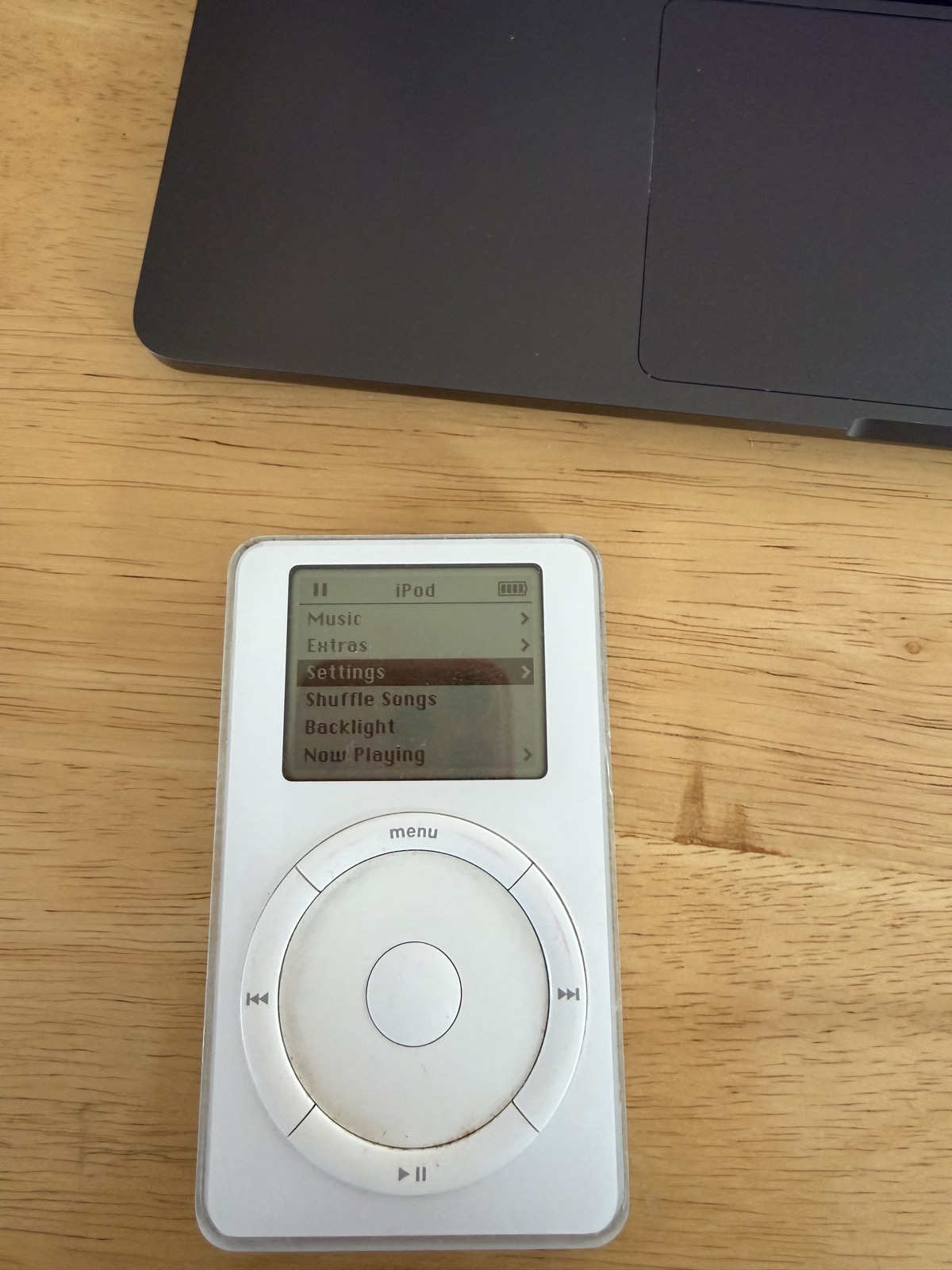a Gen 2 iPod Classic Still Kicking. I sort of dig the reflection of my iPhone in the glass of the iPod ...